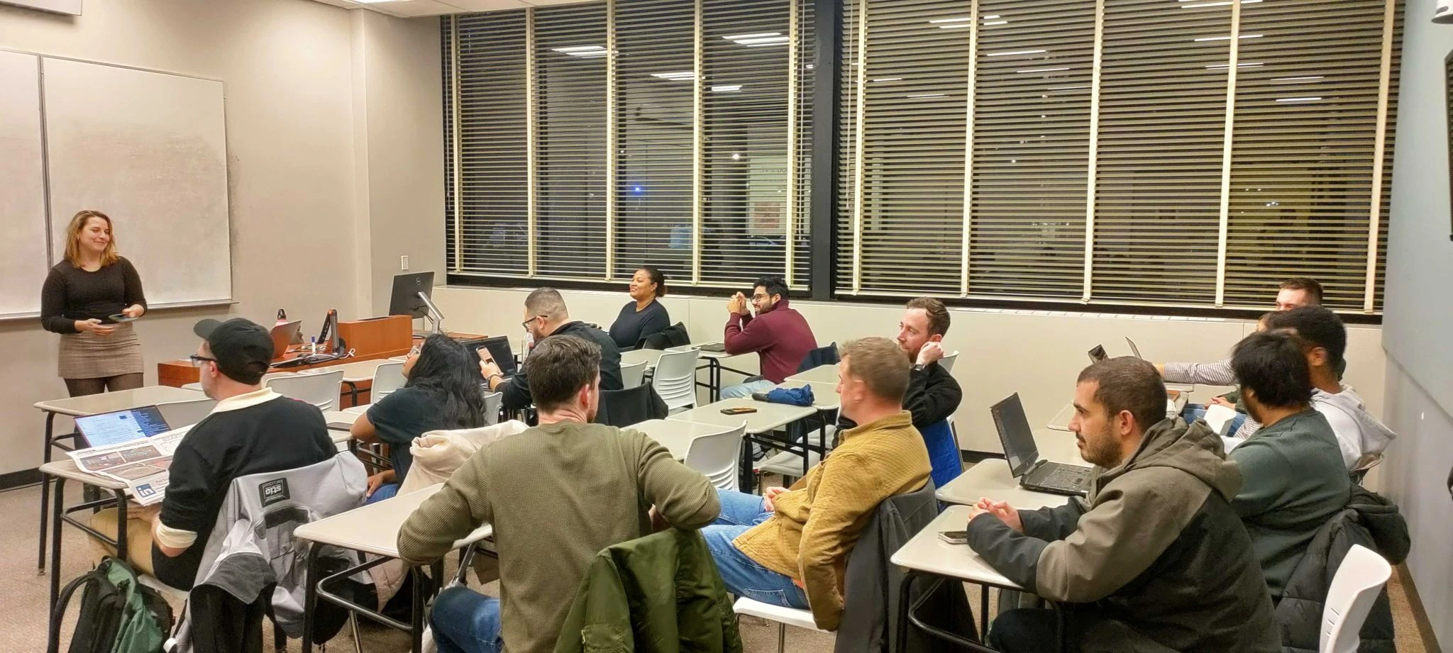 Amanda leading a full classroom at IIT on coroutines.